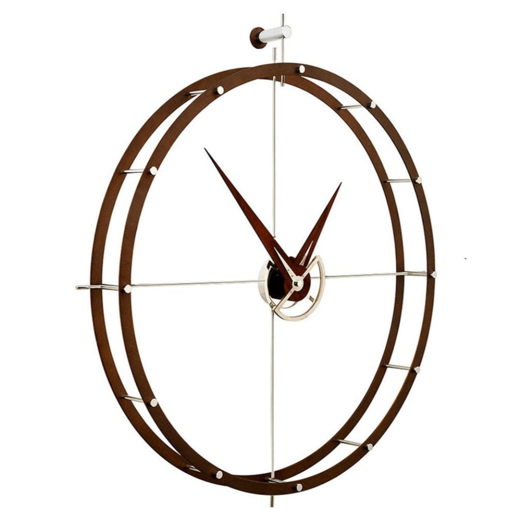 A Nomon clock with a circular design on a white background made of chromed steel. available at Spacio retail stores in Mumbaii & Kolkata and online.