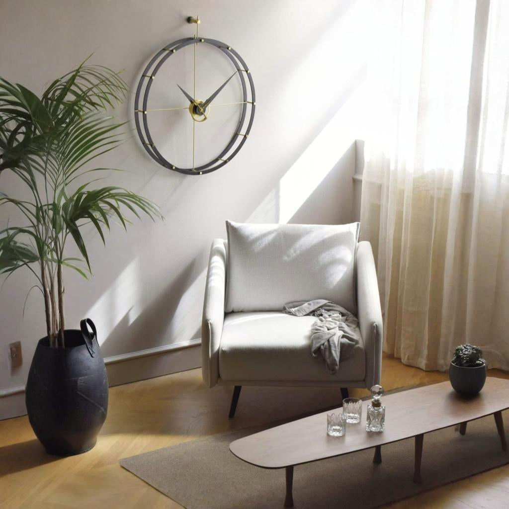 Modern living room with a white armchair, coffee table, and decorative items.
