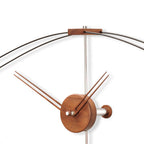 Wooden wall clock with metal accents on a white background