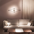 Modern living room with a beige sofa, wooden coffee table, and wall-mounted clock.