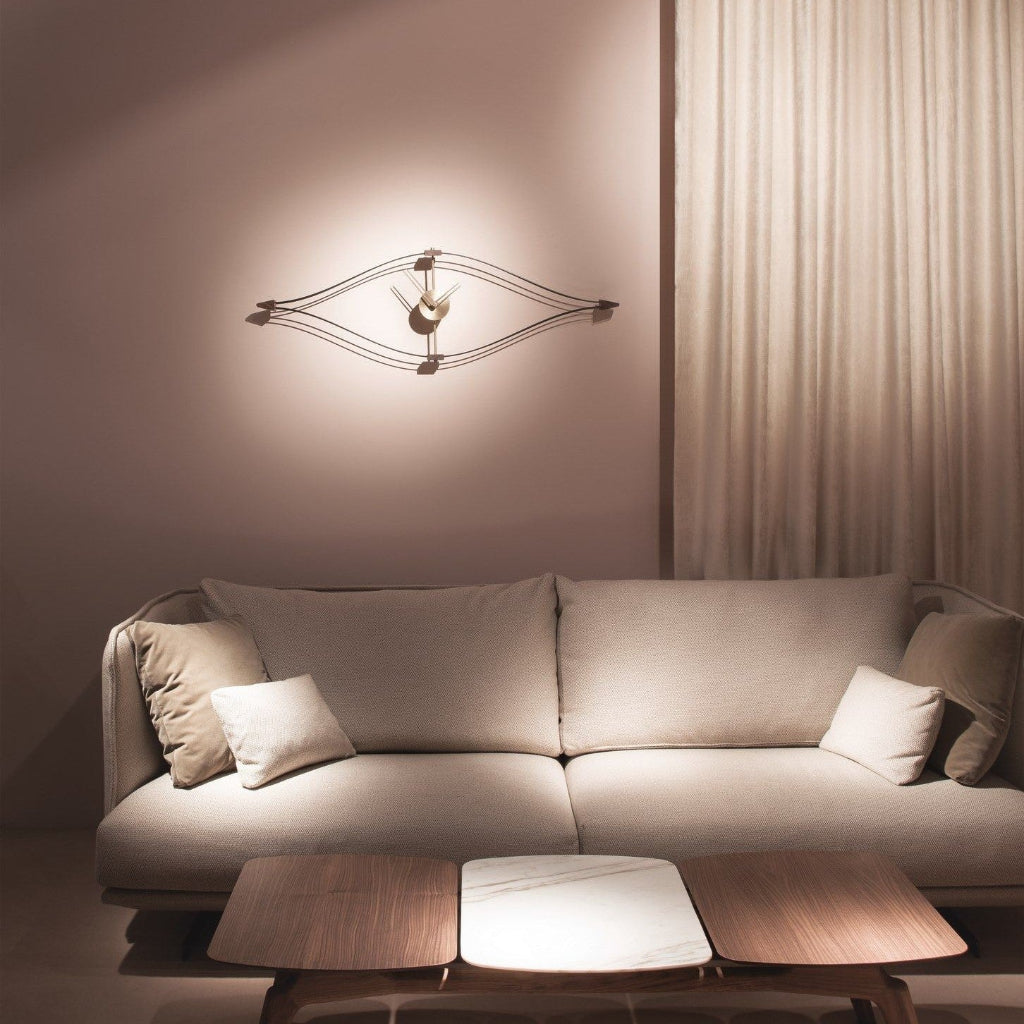 Modern living room with a beige sofa, wooden coffee table, and wall-mounted clock.