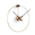 A Nomon Micro Anda G MCANG wall clock with a circular shape hanging on a wall. available at Spacio retail stores in Mumbaii & Kolkata and online.