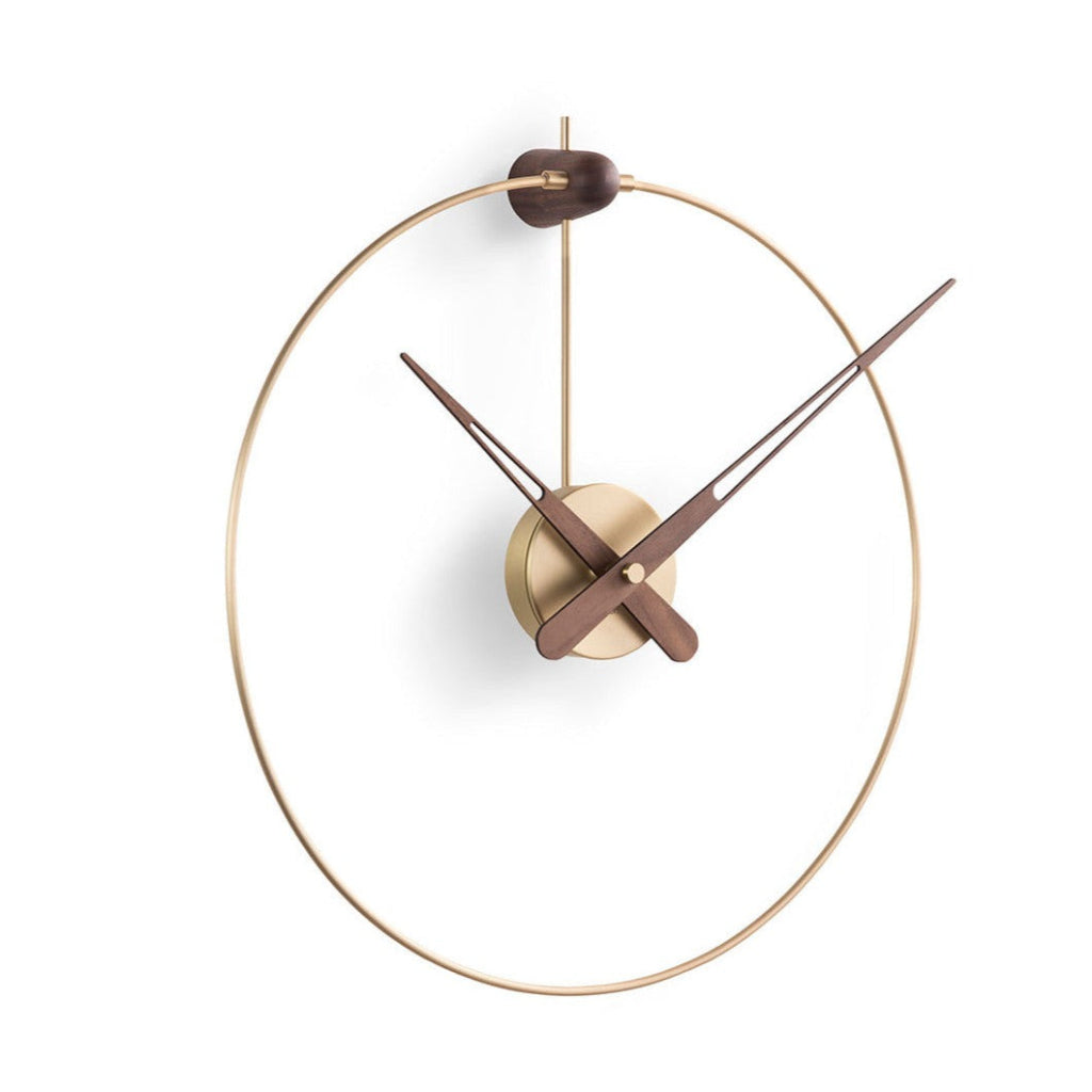 A Nomon Micro Anda G MCANG wall clock with a circular shape hanging on a wall. available at Spacio retail stores in Mumbaii & Kolkata and online.