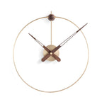 Modern wall clock with gold rim and brown accents on a white background