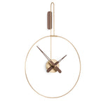 A Nomon Clock Nomon Micro Daro G Walnut MDADN hanging on a white wall in luxury interiors. available at Spacio retail stores in Mumbaii & Kolkata and online.