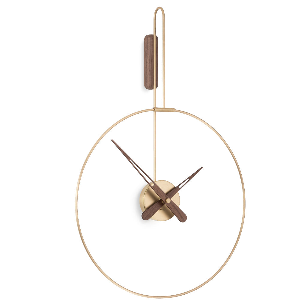 A Nomon Clock Nomon Micro Daro G Walnut MDADN hanging on a white wall in luxury interiors. available at Spacio retail stores in Mumbaii & Kolkata and online.