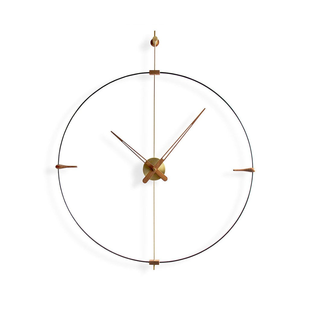 Modern wall clock with gold hands and frame on a white background available at Spacio retail stores in Mumbaii & Kolkata and online.