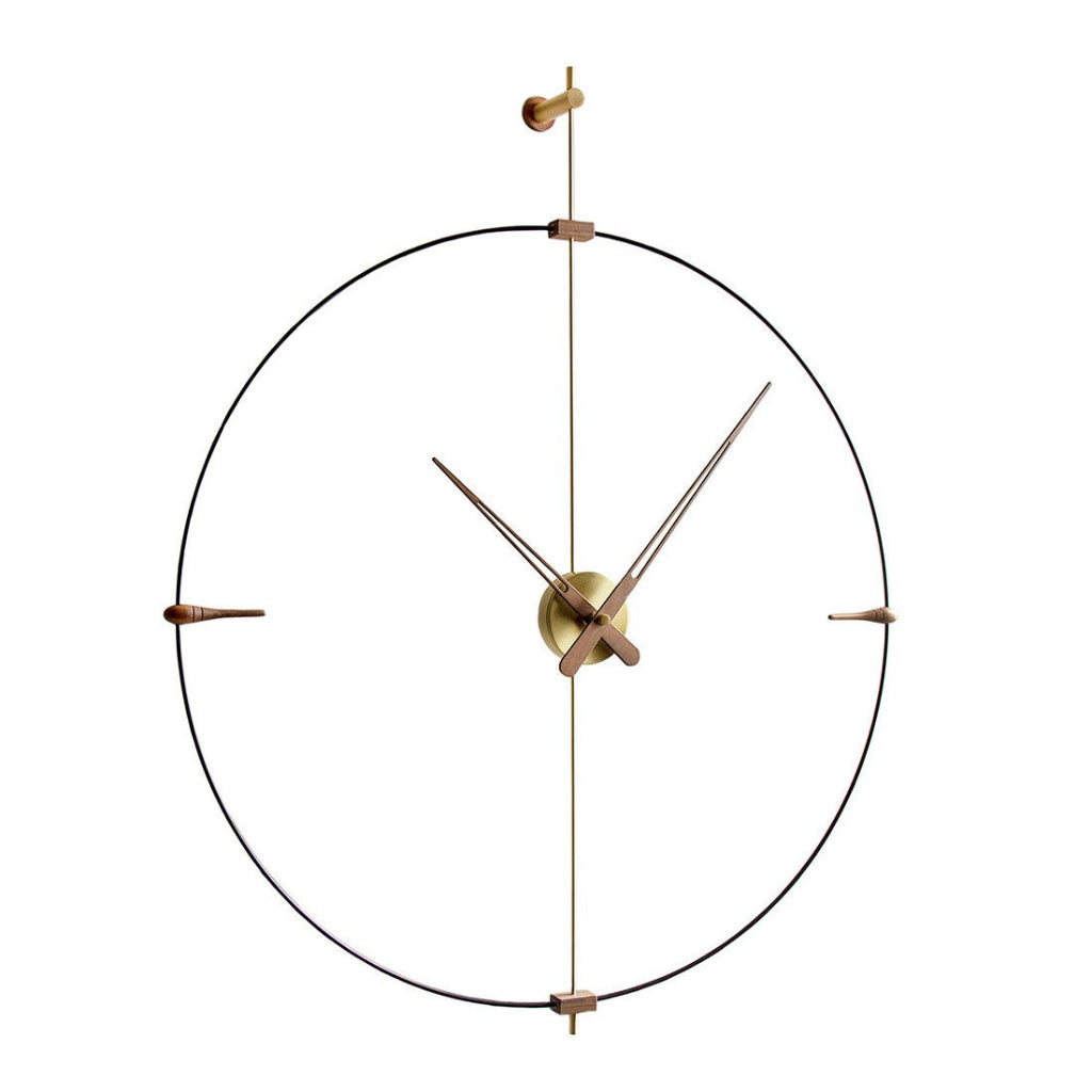 Decorative wall clock with gold hands and frame on a white background