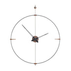 A Clock Nomon Mini Bilbao MBI with a sleek circular design hanging on a wall. available at Spacio retail stores in Mumbaii & Kolkata and online.