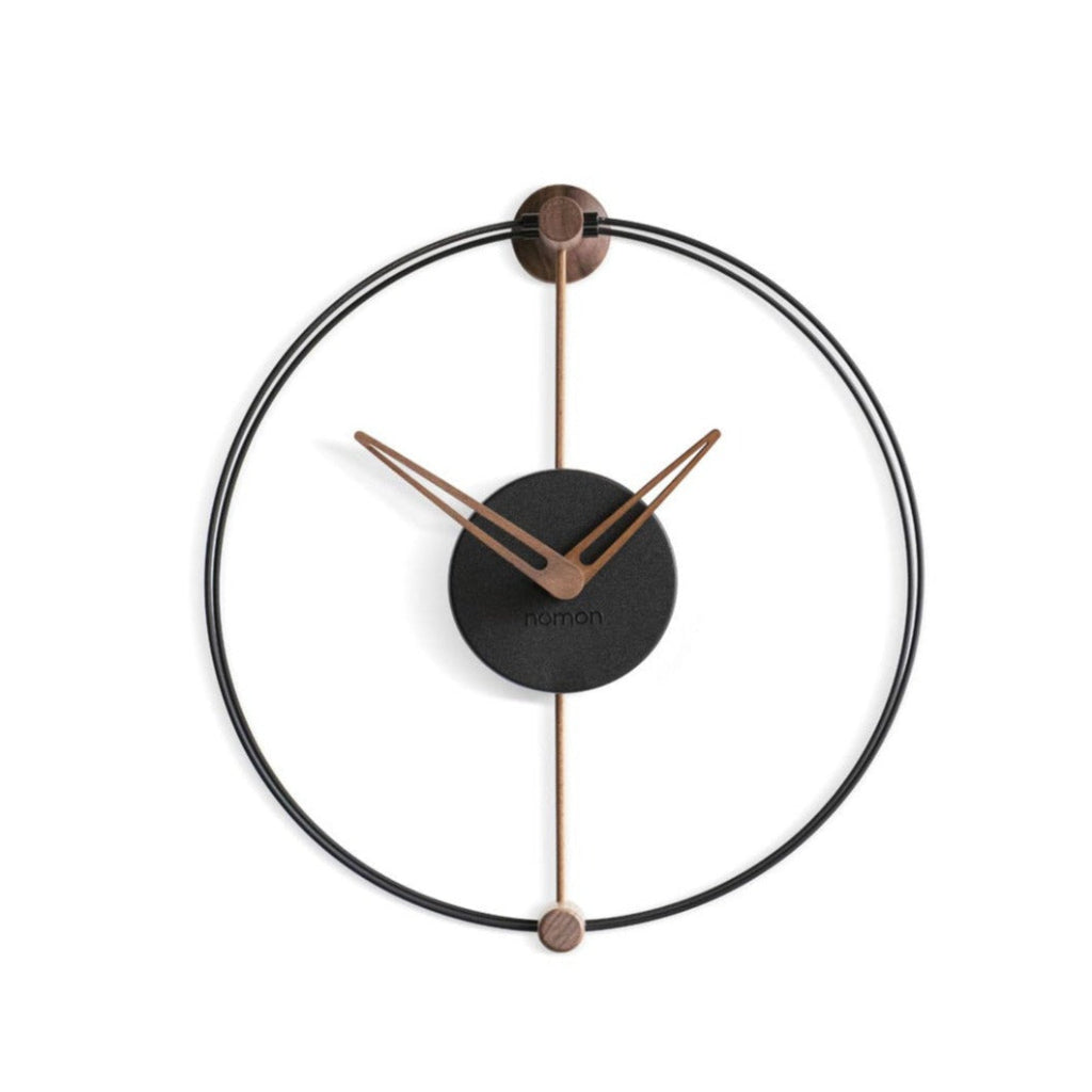 A modern Nomon Nano clock with a black and copper Nordic air design. available at Spacio retail stores in Mumbaii & Kolkata and online.