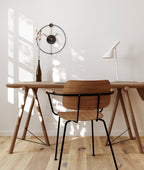 Wooden desk with chair in a bright room