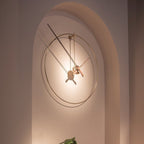 Modern wall clock with a minimalistic design on a neutral wall.