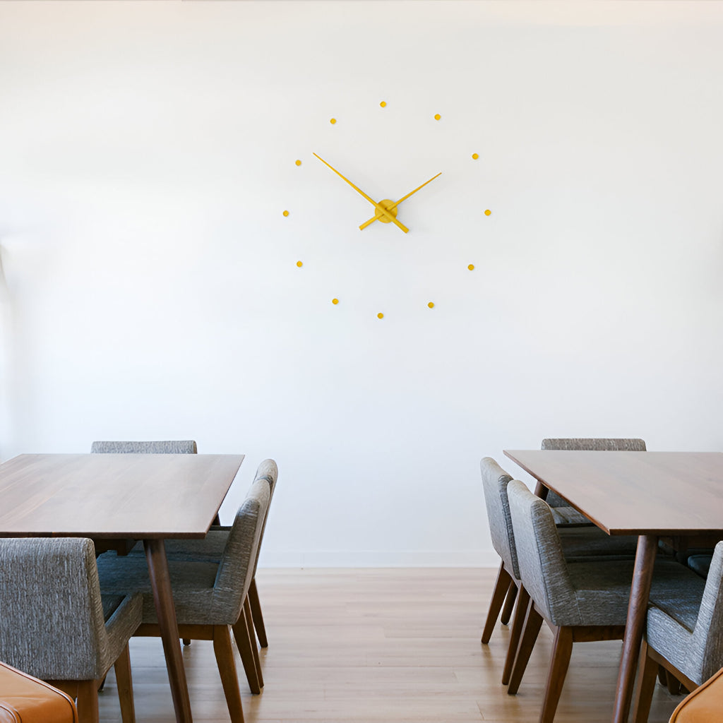 Modern dining area with wooden tables and gray chairs, featuring a unique yellow clock on the wall.