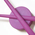 Purple makeup sponge and applicator on a white background with 'nai' branding.