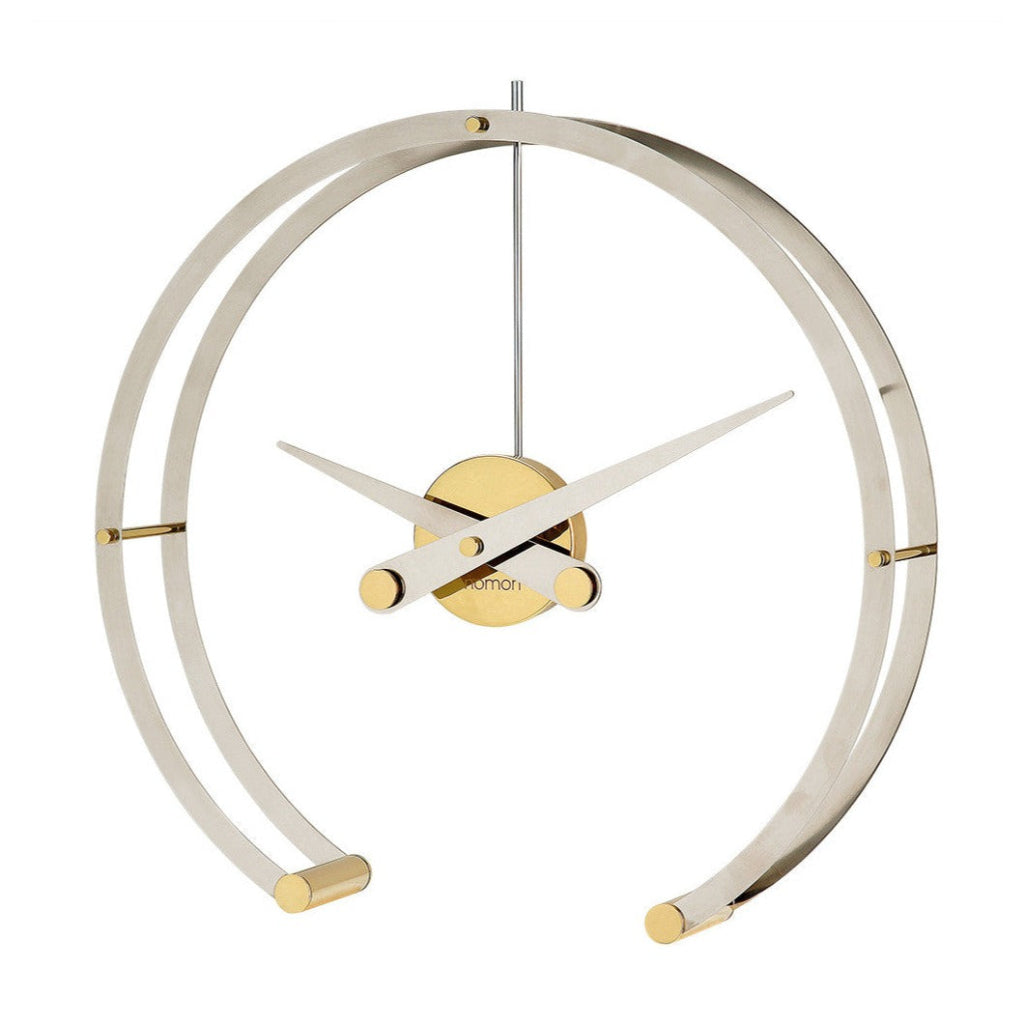 A sleek gold and brass Clock Nomon Omega G OMG with a professional style, featuring a circular shape. available at Spacio retail stores in Mumbaii & Kolkata and online.