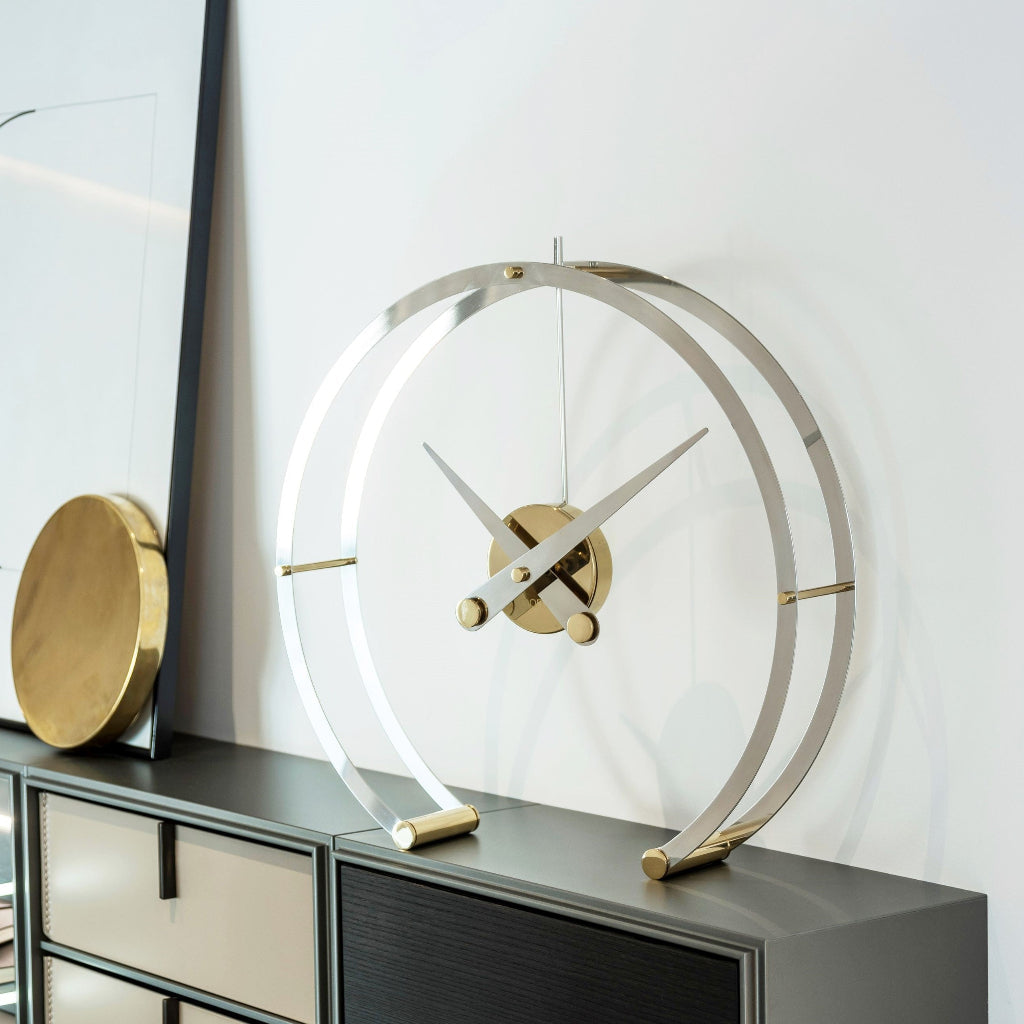 Modern decorative clock on a dark surface with a light background