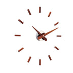 Wooden clock face with brown hour markers on a white background available at Spacio retail stores in Mumbaii & Kolkata and online.