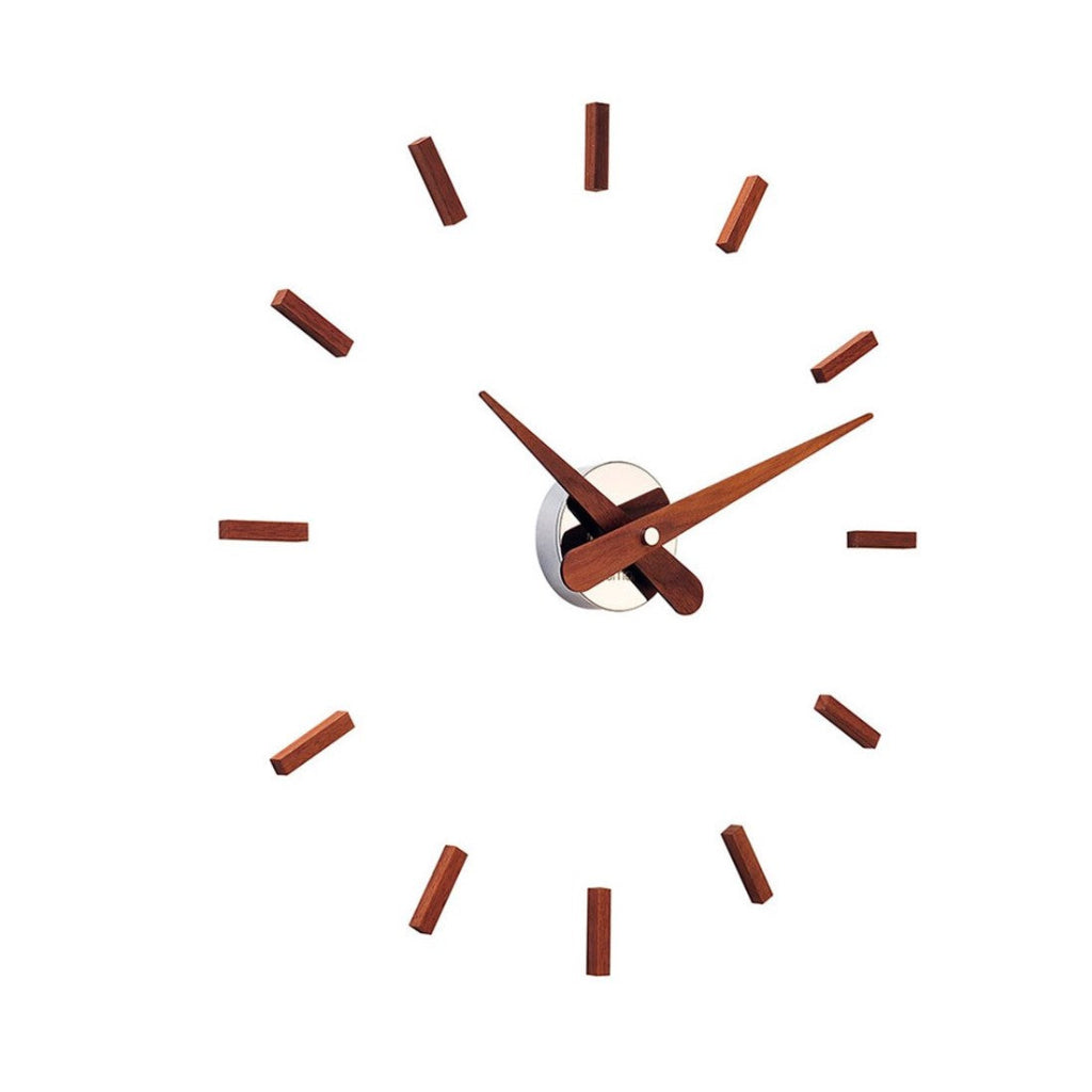 Wooden clock face with brown hour markers on a white background available at Spacio retail stores in Mumbaii & Kolkata and online.