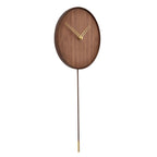 Wooden wall clock with a long pendulum on a white background