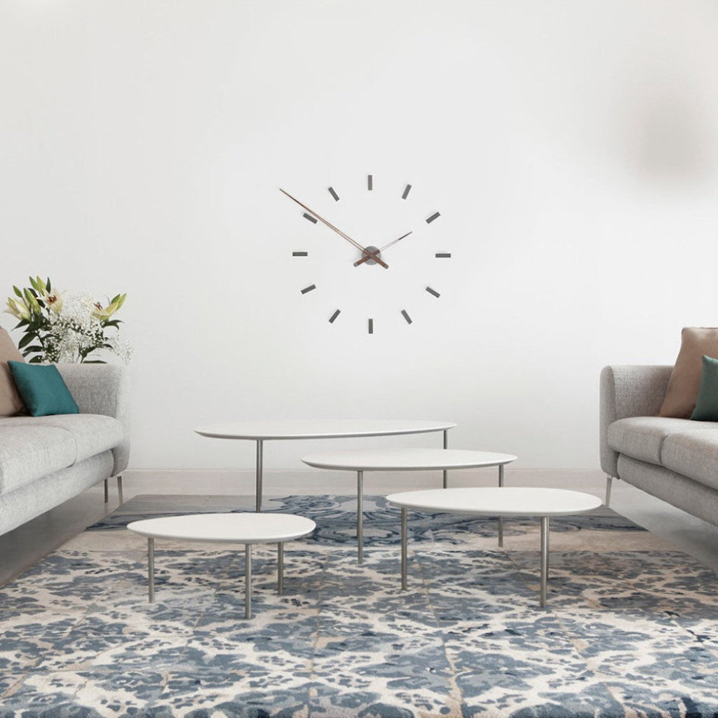 Nomon Spain Tacon T 12 Graphite on a white wall of minimal & modern interior available at Spacio India for luxury home decor collection of Timepieces & Clocks.