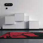 Modern interior with white furniture and a red and black rug.