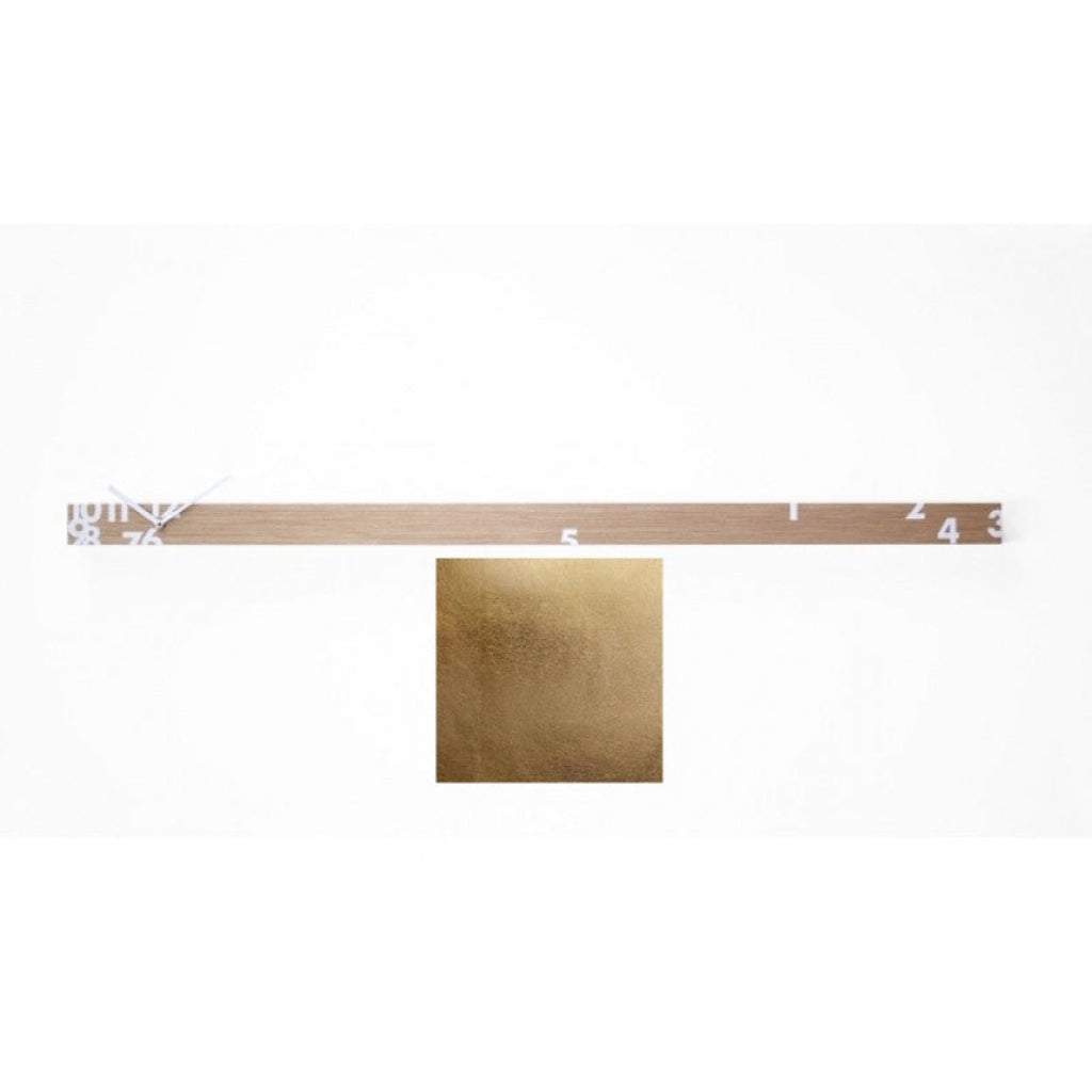 Metallic gold sample with a ruler for scale on a white background from Progetti available at Spacio retail stores in Mumbaii & Kolkata and online.