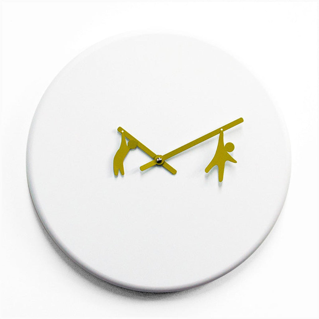 White wall clock with gold hands on a white background from Progetti available at Spacio retail stores in Mumbaii & Kolkata and online.