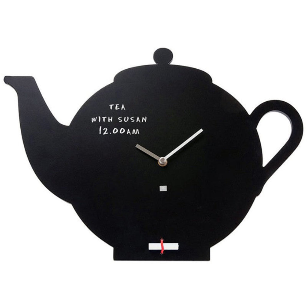 Black teapot-shaped clock with text on a white background from Pt available at Spacio retail stores in Mumbaii & Kolkata and online.