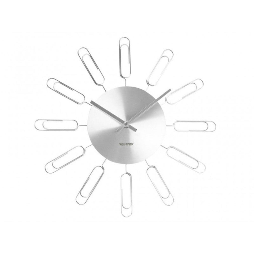 Silver wall clock with unique design on a white background from PT available at Spacio retail stores in Mumbaii & Kolkata and online.