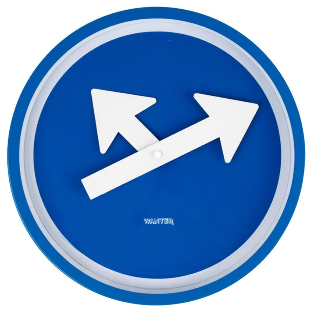 Blue circular sign with white arrows and 'WANTED' text on a white background from PT available at Spacio retail stores in Mumbaii & Kolkata and online.