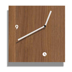 Wooden wall clock with minimal design on a white background from Tothora available at Spacio retail stores in Mumbaii & Kolkata and online.