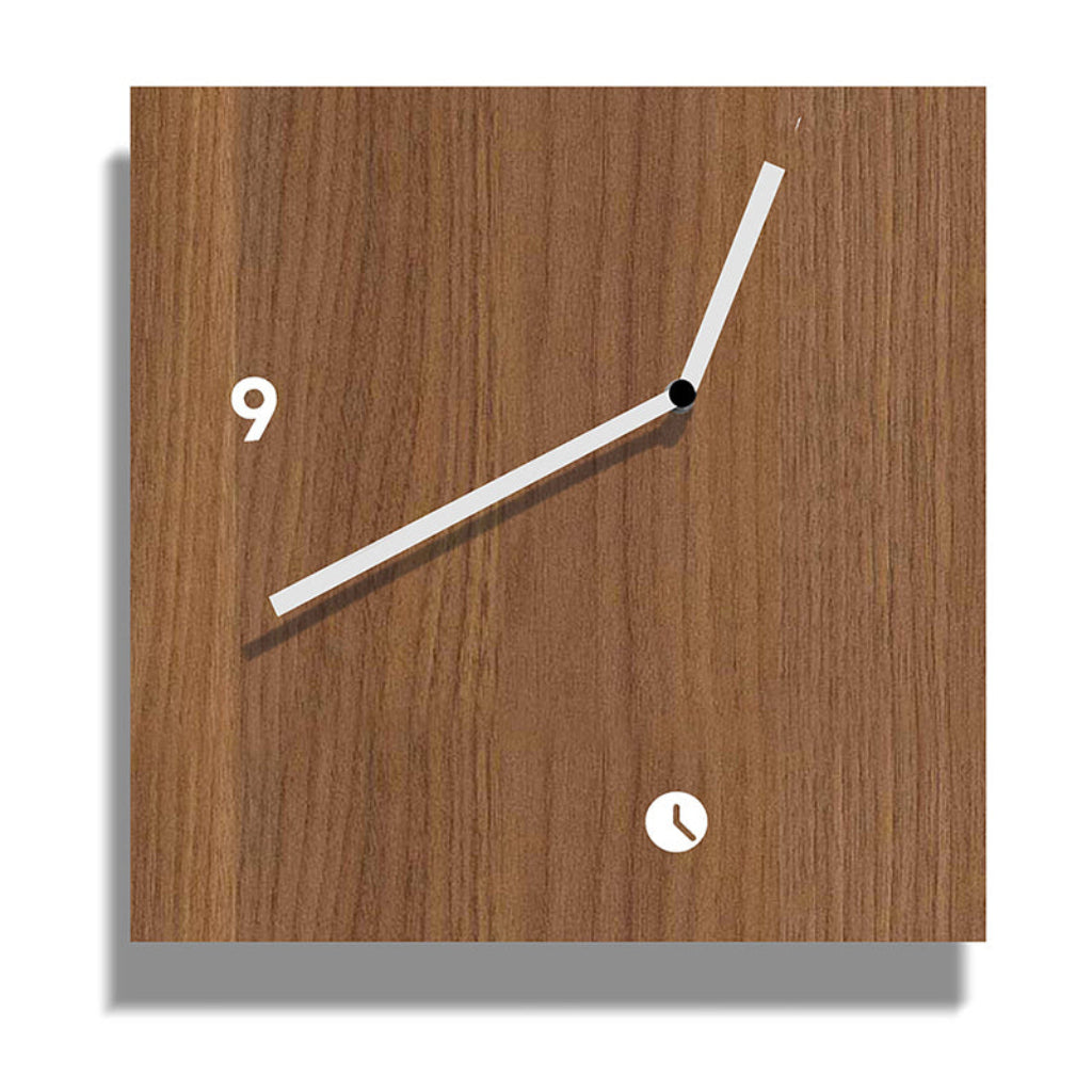 Wooden wall clock with minimal design on a white background from Tothora available at Spacio retail stores in Mumbaii & Kolkata and online.