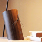 Wooden lamp with metallic accents on a surface with a soft background