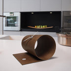 Modern kitchen with a unique brown clock on a white countertop